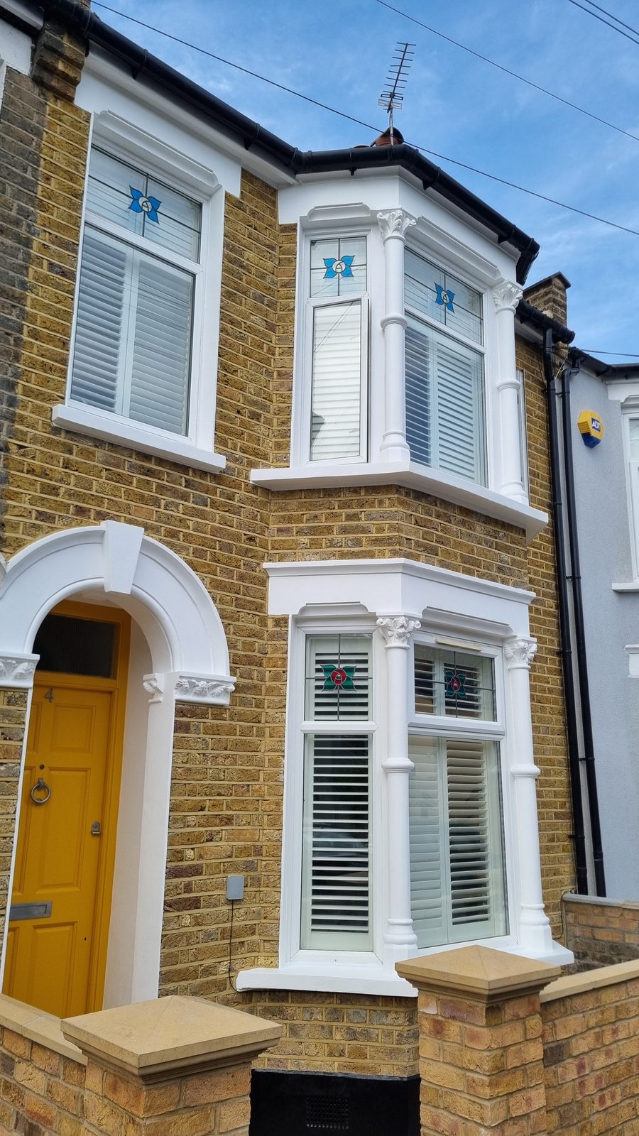 A restored Victorian bay window, columns and corbels brought back — JAG Construction, Acacia Road