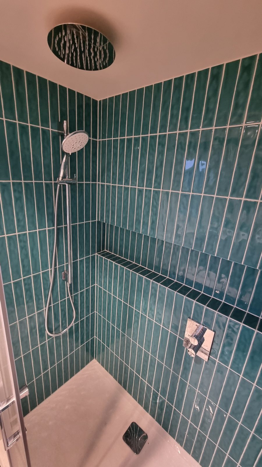 A teal-tiled shower with tiled niche shelf — JAG Construction, Belgrave Road
